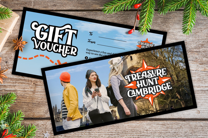 A gift voucher for Treasure Hunt Cambridge on a table covered with Christmas decorations