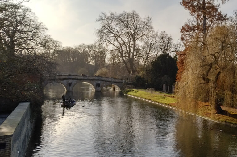 A view over the River Cam, with punters in the sunshine.